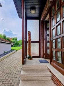 an open door of a house with a statue at Ferienhaus Anni Rödental in Rödental