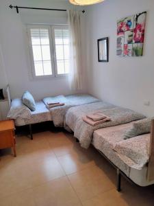 Postel nebo postele na pokoji v ubytování Apartamento Grande Centrico + 19 fotografií