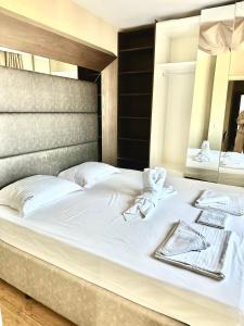 A bed or beds in a room at Botabara Del Mar Boutique