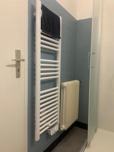 a bathroom with a shower and a towel at Location 2 pers centre historique de quimper in Quimper