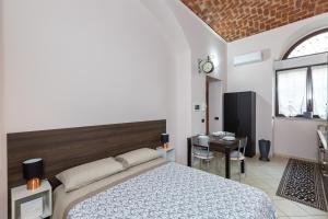 En eller flere senge i et værelse på IN CORTILE