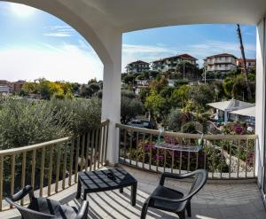 a balcony with chairs and a table and a view at Hotel Bellavista in San Bartolomeo al Mare