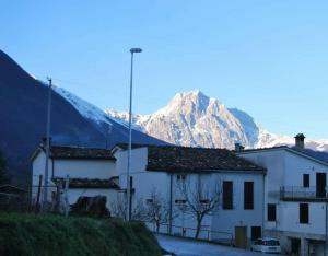 a group of buildings with a mountain in the background at Dimora Monte Camicia in Castelli
