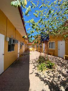 an empty hallway of a school building with a tree at Das Traum Guest Haus Siquijor in Siquijor