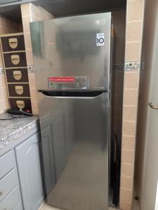 a stainless steel refrigerator in a kitchen at STAR APPARTEMENT GAUTHIER in Casablanca
