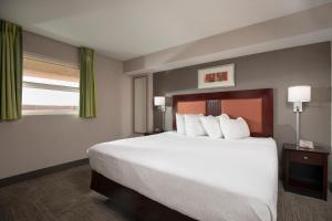 מיטה או מיטות בחדר ב-Prince Resort