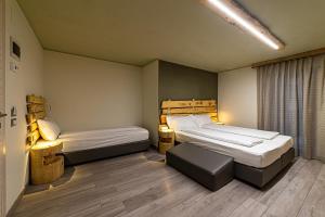 Posteľ alebo postele v izbe v ubytovaní Chalet Margoni