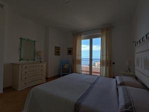 Postel nebo postele na pokoji v ubytování Splendida vista sul mare