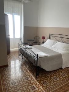 a bedroom with a bed in a room with a window at casa san Pietro in Rome