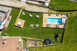 an aerial view of a yard with a swimming pool at Der Brunnerhof in Mühlbach