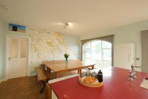 a kitchen with a table and a counter top with a table at Goldenhill Retreats in Bamburgh