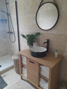a bathroom vanity with a sink and a mirror at Casa Sierra -Etretat in Sainte-Marie-au-Bosc +21 photos