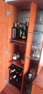 a cupboard filled with lots of bottles of alcohol at Val do Fragoso in Vigo