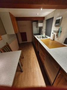 a kitchen with a sink and a counter top at Rural in Assens