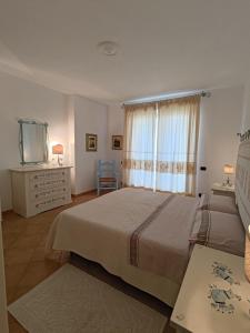 Postel nebo postele na pokoji v ubytování Splendida vista sul mare