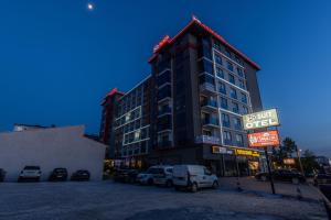 a large building with a sign in front of it at ND Suite in Edirne