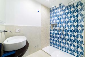 a bathroom with a white sink and a shower at Dimora Bertella boutique & SpA in Amalfi