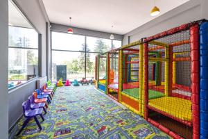 a room with a play area with colorful play equipment at ND Suite in Edirne