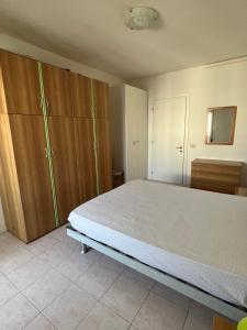 Postel nebo postele na pokoji v ubytování App. Mare V&V Caorle + 24 fotografií