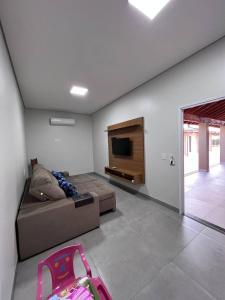 TV a/nebo společenská místnost v ubytování Casa de Temporada Mouton