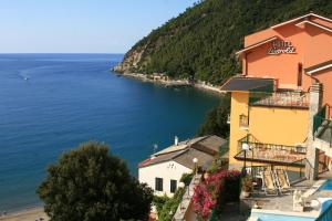 a view of a town and the ocean at Hotel Leopold in Moneglia