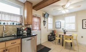 a kitchen with a table and a ceiling fan at Garrett Hill in Bryn Mawr