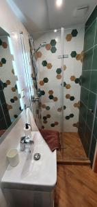 a bathroom with a sink and a shower at Domki letniskowe "U Adaska" in Chałupy +26 photos