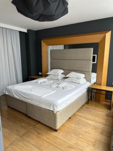 A bed or beds in a room at Botabara Del Mar Boutique