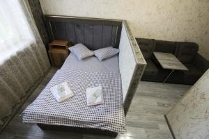 Un pat sau paturi într-o cameră la Oazis