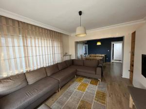 a living room with a couch and a table at Bosphorus waterfront flat, Cengelköy in Istanbul