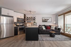 a kitchen and a living room with a couch at Iron Horse C3013 condo in Winter Park