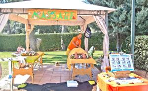 a woman sitting on a bed under a tent at BQ Belvedere Hotel in Palma de Mallorca