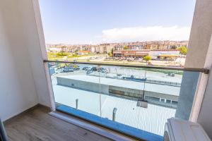 a balcony with a view of a parking lot at ND Suite in Edirne