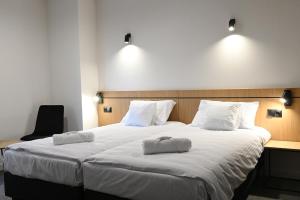 Postel nebo postele na pokoji v ubytování Hotel Parrot