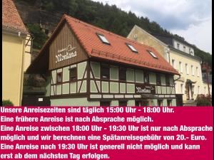 a building with a sign in front of it at Ferienhaus Montana in Bad Schandau