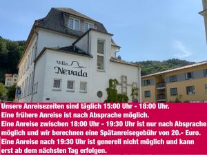 a building with a sign on the side of it at Villa Nevada - Adults only in Bad Schandau