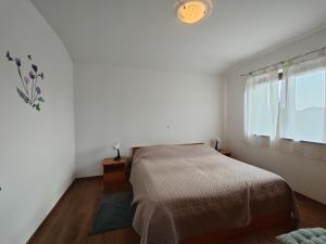 Postel nebo postele na pokoji v ubytování Apartments Bevanda