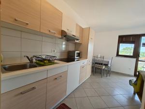 Kuchyň nebo kuchyňský kout v ubytování Apartments Bevanda