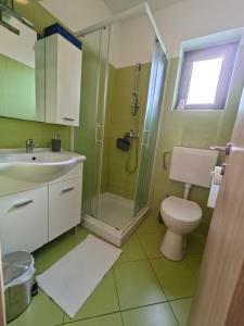Koupelna v ubytování Apartments Bevanda