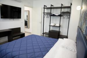 A bed or beds in a room at Palazzo Archeo