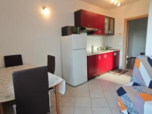 Kuchyň nebo kuchyňský kout v ubytování Apartments Bevanda