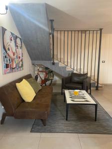 a living room with a couch and a table at INDUSTRY HOME in Catania