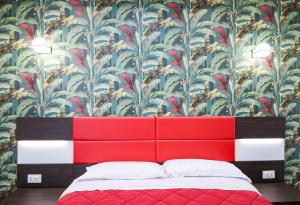 A bed or beds in a room at Palazzo Archeo