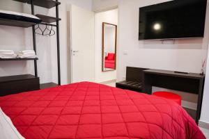 A bed or beds in a room at Palazzo Archeo