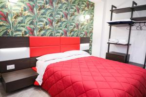 A bed or beds in a room at Palazzo Archeo