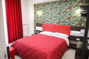 A bed or beds in a room at Palazzo Archeo