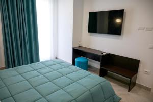 A bed or beds in a room at Palazzo Archeo