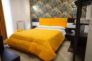 A bed or beds in a room at Palazzo Archeo
