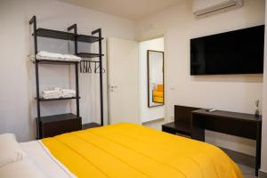 A bed or beds in a room at Palazzo Archeo