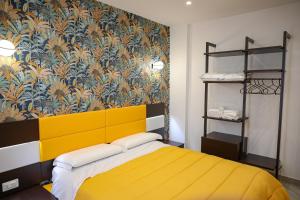 A bed or beds in a room at Palazzo Archeo